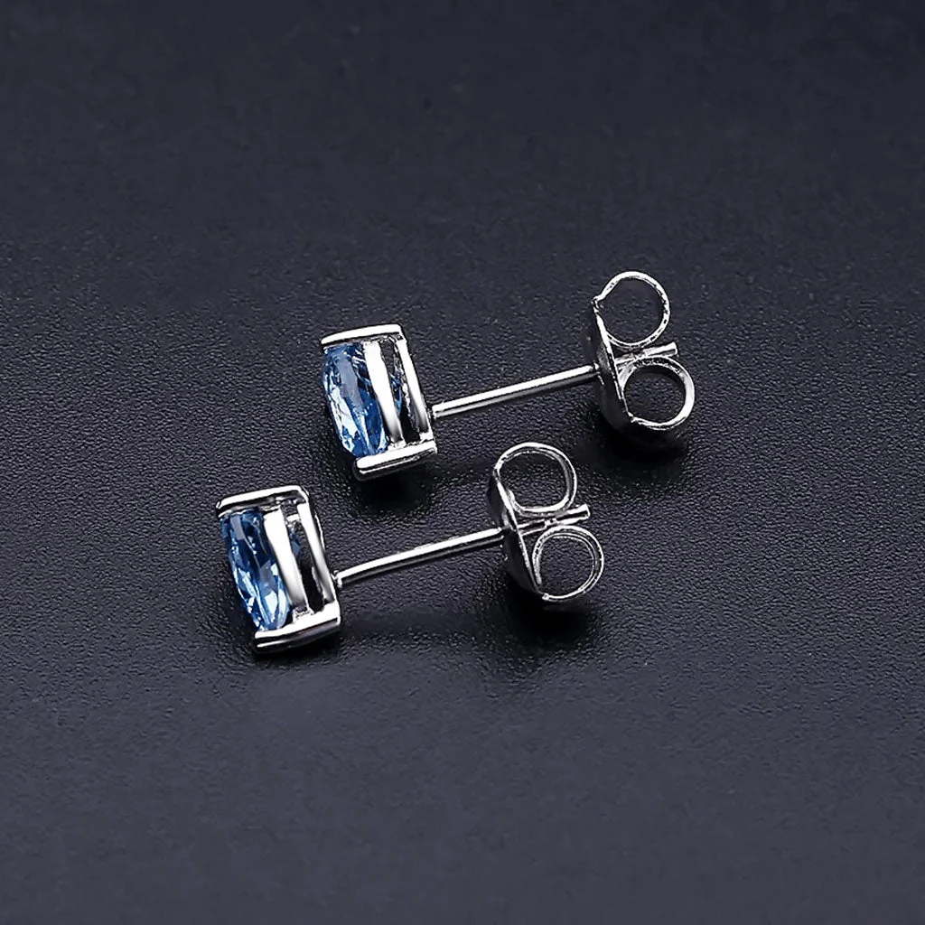 Opulent Pear Shaped Halo Swiss Blue Topaz Stud Earrings - Image 2